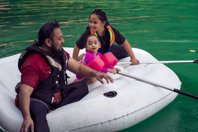 People sitting on boat in water