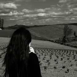 Scenic view of landscape against cloudy sky