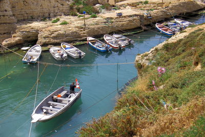 High angle view of sailboats moored in sea