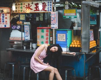 Young woman sitting in restaurant