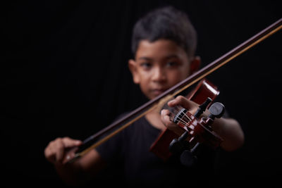 Portrait of man playing guitar