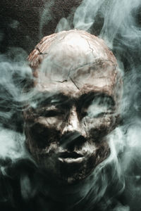 Digital composite image of man smoking