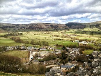 Scenic view of landscape against cloudy sky