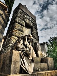 Low angle view of statue against building