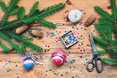 High angle view of christmas decorations on wooden table