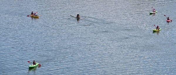 High angle view of people enjoying in boats