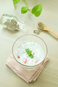 High angle view of chia seeds milk pudding on table