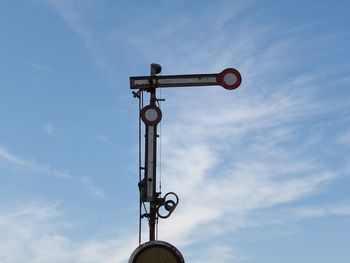 Low angle view of street light against sky