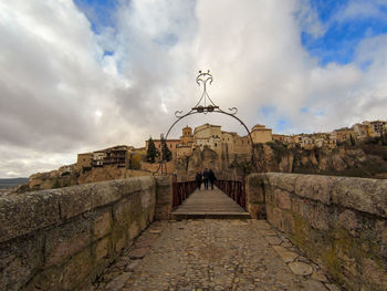 View of old building against cloudy sky