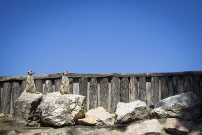 Stone wall against clear blue sky
