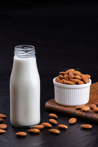 Close-up of breakfast on table against black background