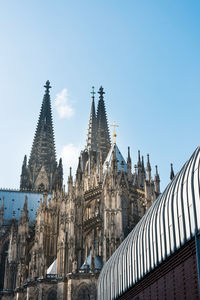Low angle view of cologne cathedral against sky in city