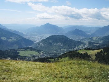 Scenic view of landscape and mountains against sky