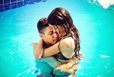 Happy boy swimming in pool