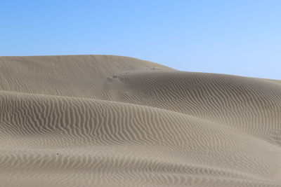 Scenic view of desert against clear sky