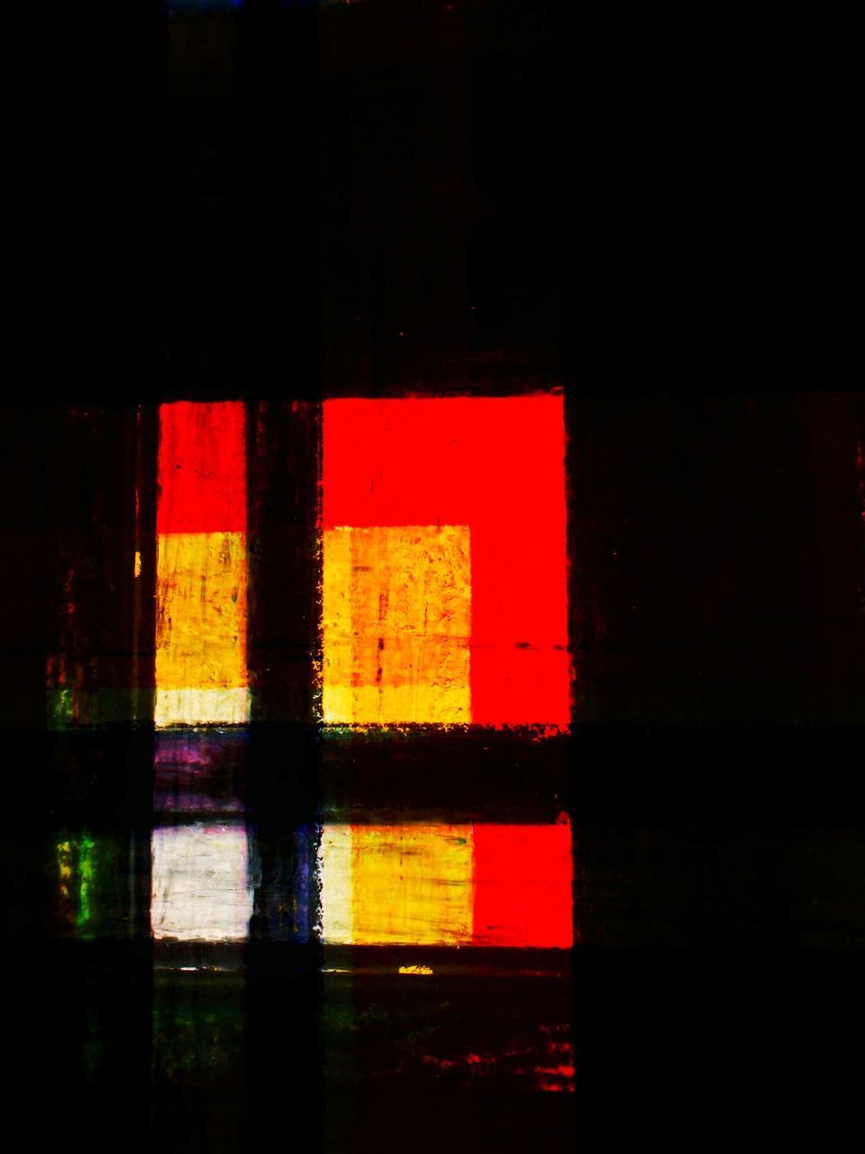 CLOSE-UP OF ILLUMINATED GLASS WINDOW