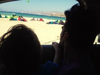 People relaxing on beach