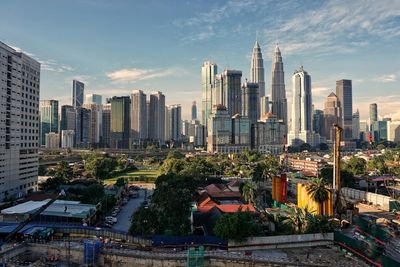 Modern buildings in city against sky