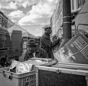 People working at market stall