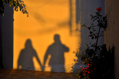 Shadow of people on wall