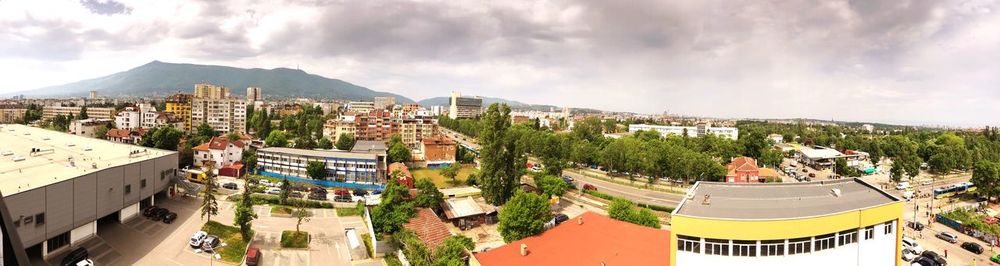 High angle view of buildings in city against sky