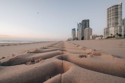 Scenic view of beach against clear sky