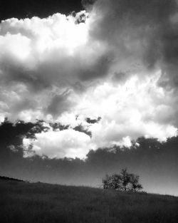 Scenic view of landscape against cloudy sky