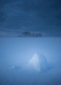 Dark winter scenery in early morning. snowy landscape during twilight.