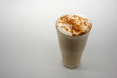 Close-up of coffee cup against white background