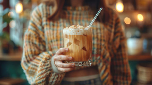 Cropped hand of woman holding ice cream cone