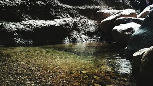 Scenic view of river against rock formation