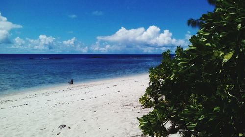 Scenic view of sea against cloudy sky