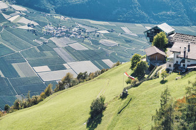 High angle view of houses and trees on field