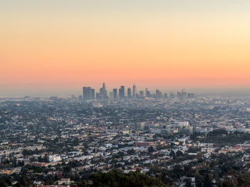 High angle view of buildings against sky during sunset