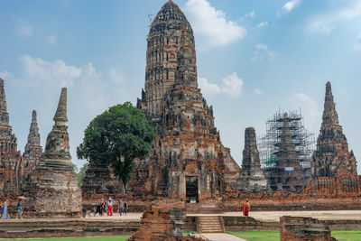 Panoramic view of temple against buildings