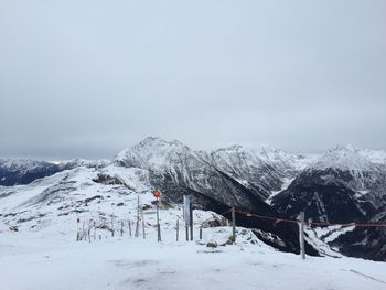 Scenic view of snowcapped mountains against clear sky