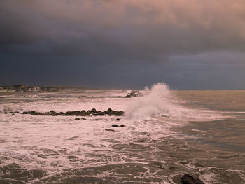 Scenic view of sea against sky at sunset