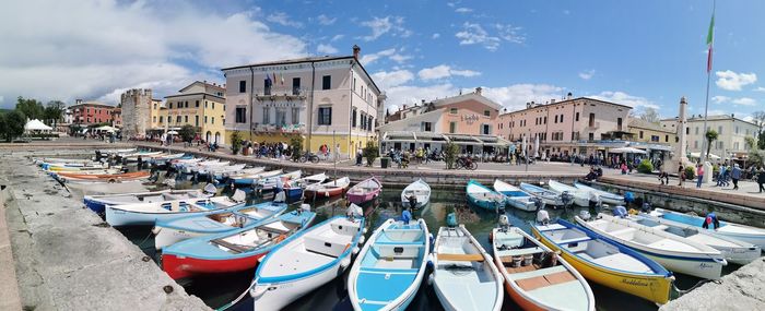 Boats moored at harbor