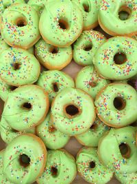 Directly above shot of green donuts on table