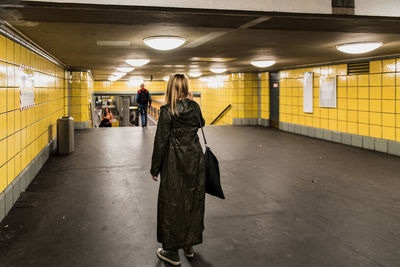 People walking in illuminated subway station