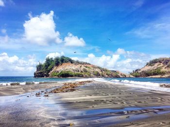 Scenic view of beach against sky