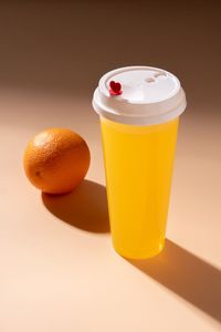 Close-up of orange juice on table