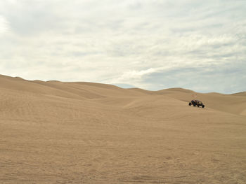 Vehicle moving on desert