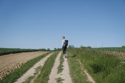 Full length of man on field against clear sky