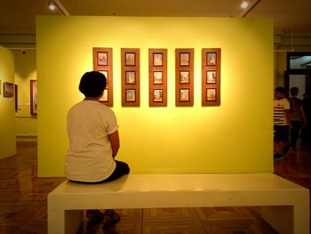 Full length of woman standing by railing