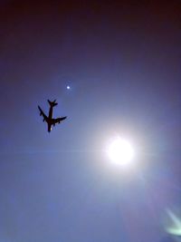Low angle view of airplane flying in sky