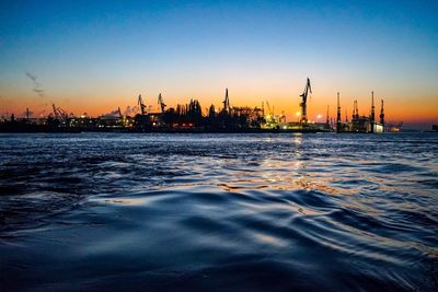 View of harbor against sky during sunset