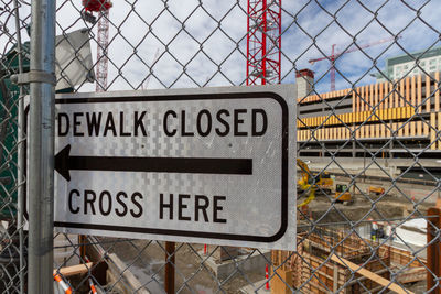 Information sign on chainlink fence