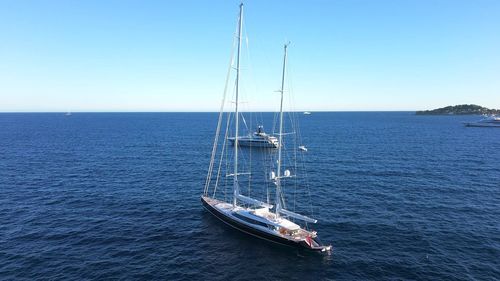 Aerial view of big sailing boat against blue sky