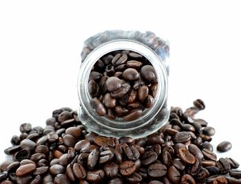 Close-up of coffee beans against white background